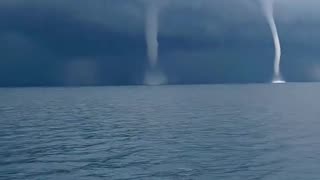 Footage captures five waterspouts forming off the coast of Italy