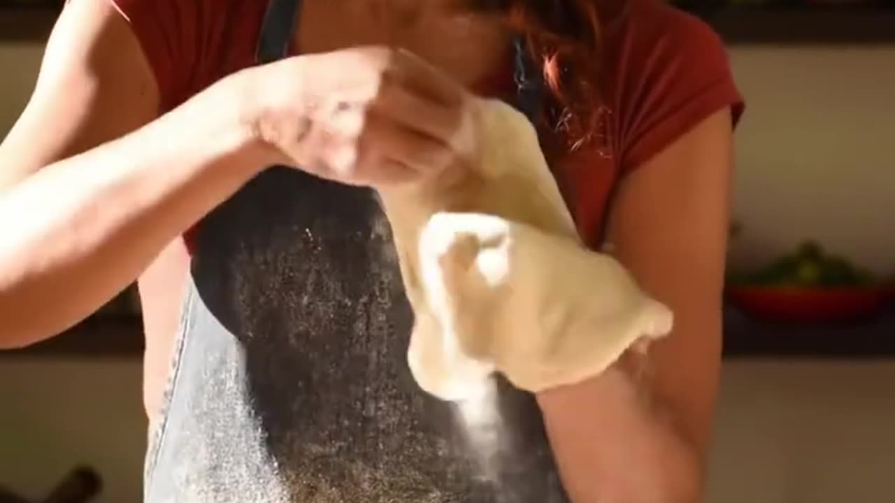 Beautiful woman making pizza