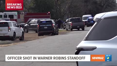 WRPD officer shot near Robins Air Force Base, as suspect barricaded in their home