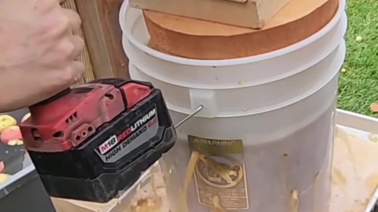 Apple cider pressing with a scissor jack and 3/8ths impact Drill