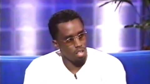 Mike Tyson having to move Diddy's hand during an interview