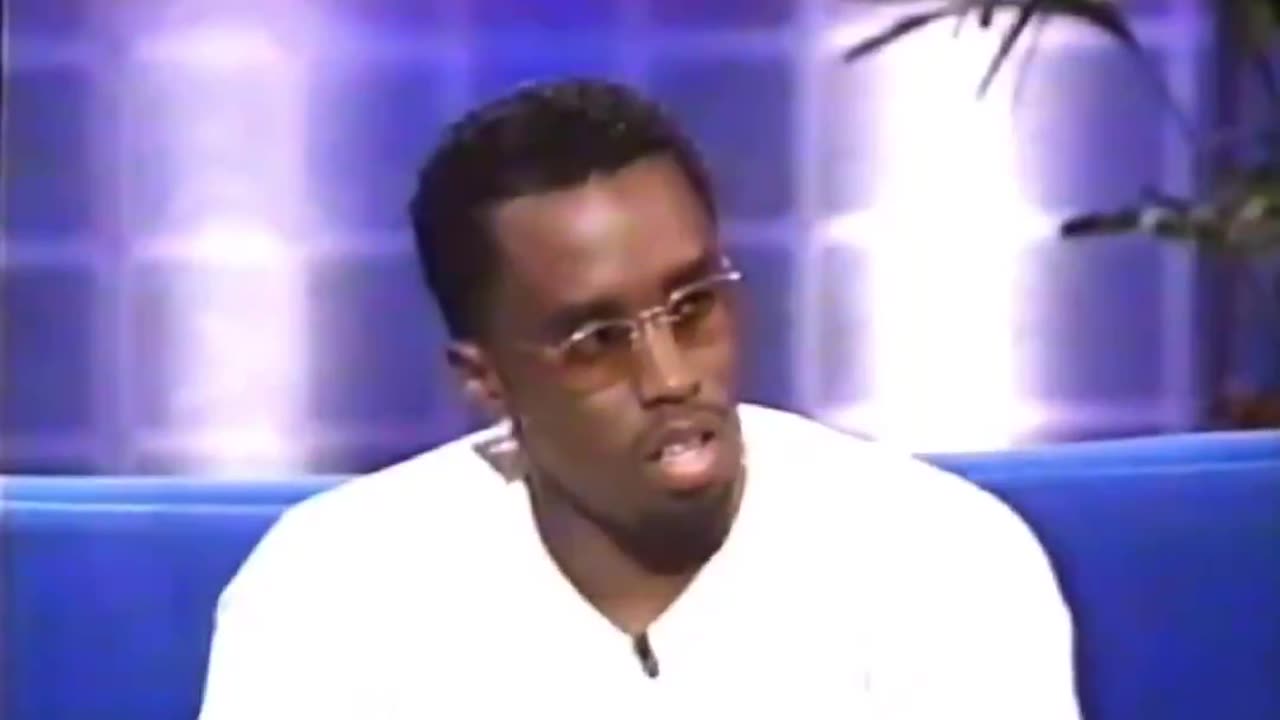 Mike Tyson having to move Diddy's hand during an interview