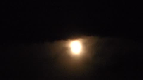 Moon with cloud over it
