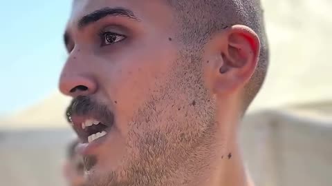 A Palestinian man speaks with anguish about the repeated bombing of his home