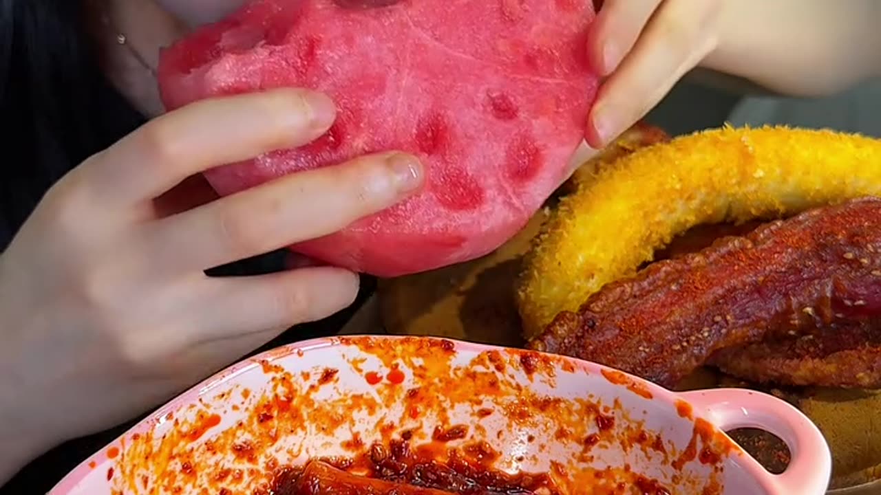 Stir-fried rice cake strips with crispy pork belly and big watermelon are so good