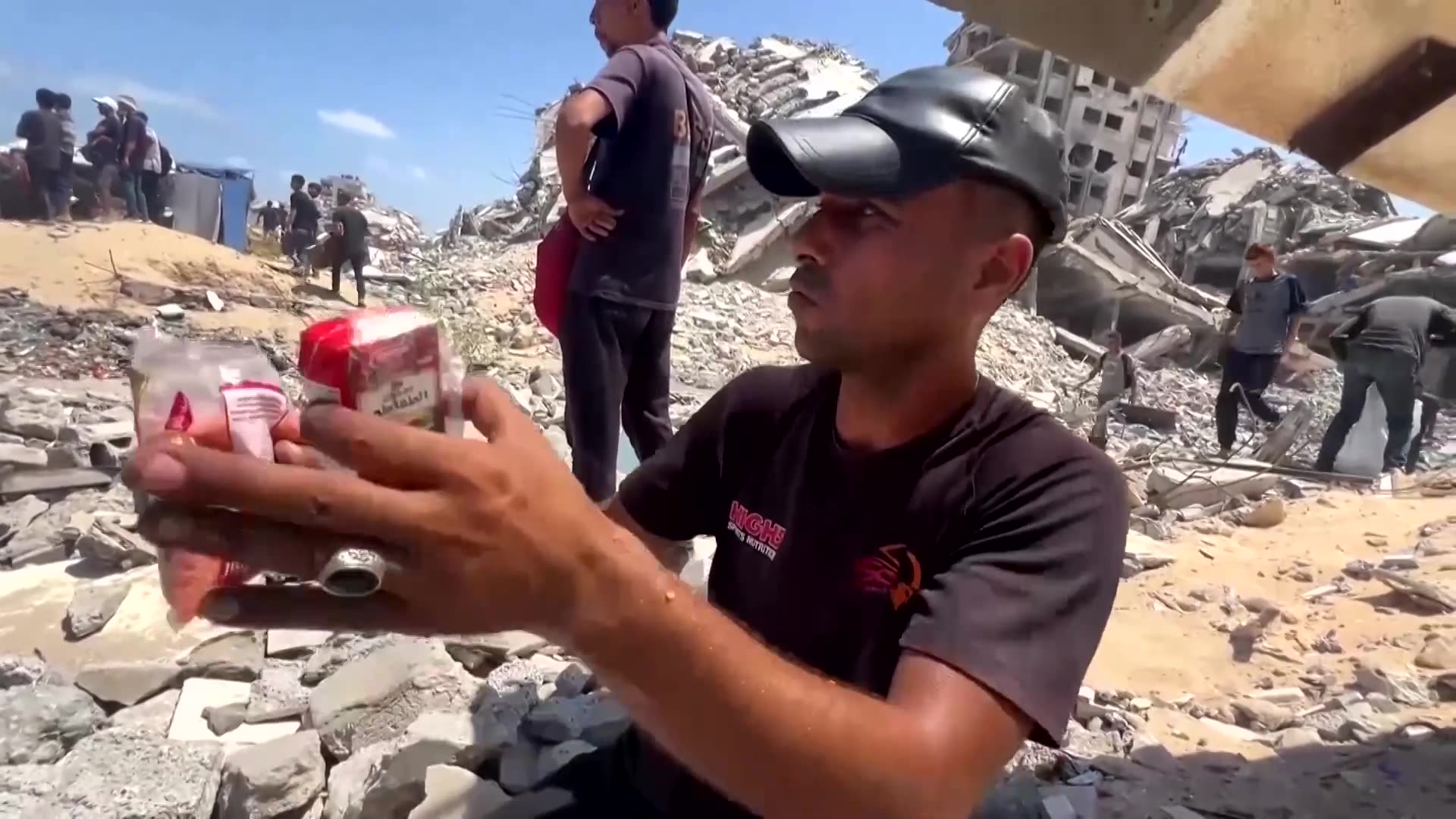 Palestinians scramble for aid, as it is airdropped over north Gaza