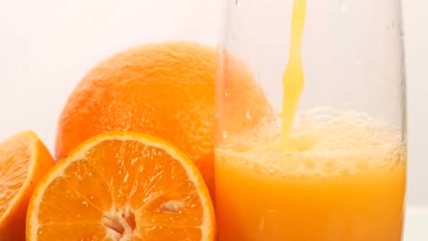 Oranges, a glass and some ices.