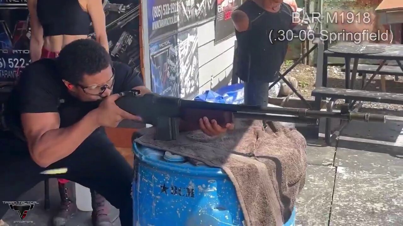 Michael B. Jordan at the range training with a BAR, Thompson submachine gun, and M1911 pistol.