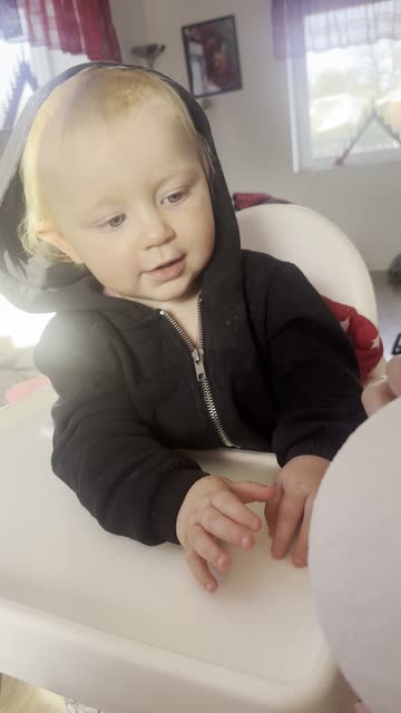 baby and sister play with ball — too cute!