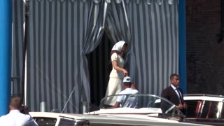 Lauren Sanchez blows a kiss while heading to San Giorgio island