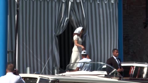 Lauren Sanchez blows a kiss while heading to San Giorgio island