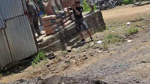 Boy Drops Bag of Sand