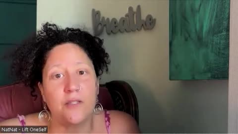 Why she has Breath on the wall in her background