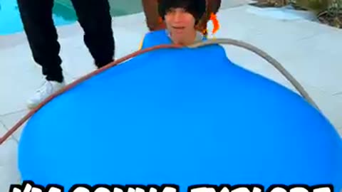 Filling a water balloon with bath bombs.