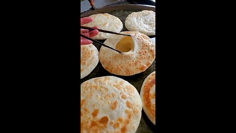 Porota and egg mixing street food