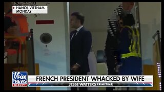 MACRON WHACKED BY HEWIFE