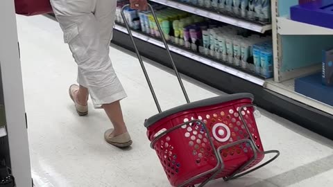 Shopper Drags Basket Around