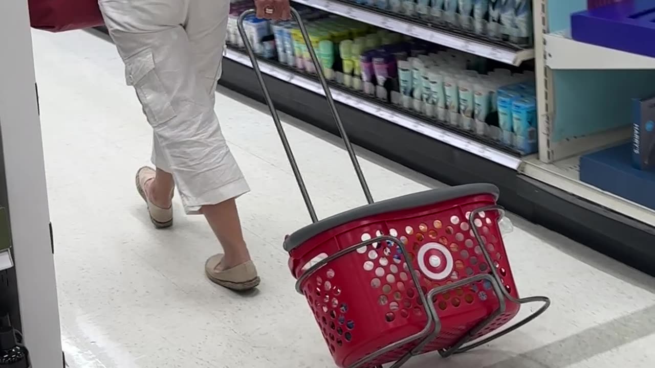 Shopper Drags Basket Around