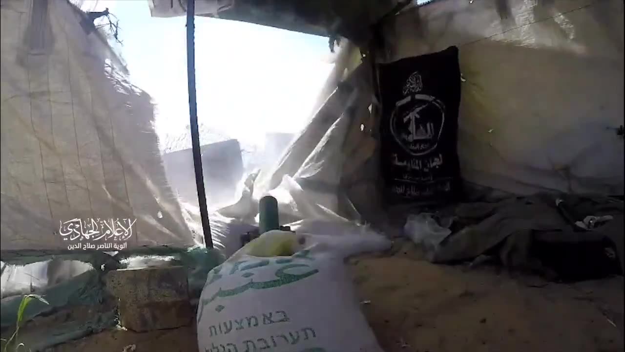 Hamas is seen firing mortars from a humanitarian tent, surrounded by bags of