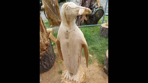 EMPEROR PENGUINE CHAINSAW CARVING