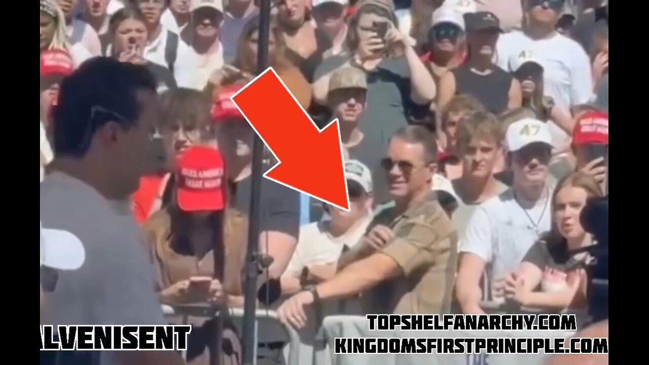 Is this Charlie Kirk's Assassin in the front row using a PALM PISTOL between his fingers?