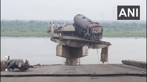 Bridge collapses near Vadodara, India, killing several people and sending cars into the river.