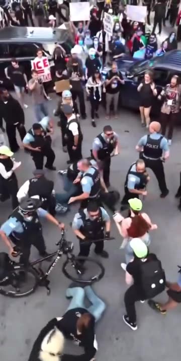 Drone footage of Chicago anti-ICE protester getting tackled and cuffed.
