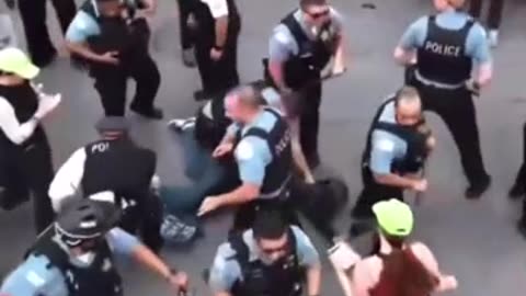 Drone footage of Chicago anti-ICE protester getting tackled and cuffed.