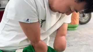 Hero boy eat noodles without hands