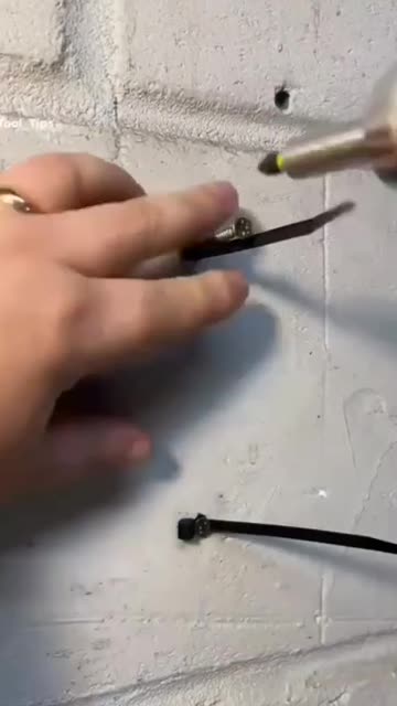 How to secure a cable to a wall.