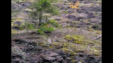 Giants using rocks as doors in the side of mountains