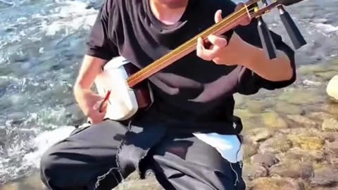 The Soulful Sound of Shamisen by the River 🎶🌊