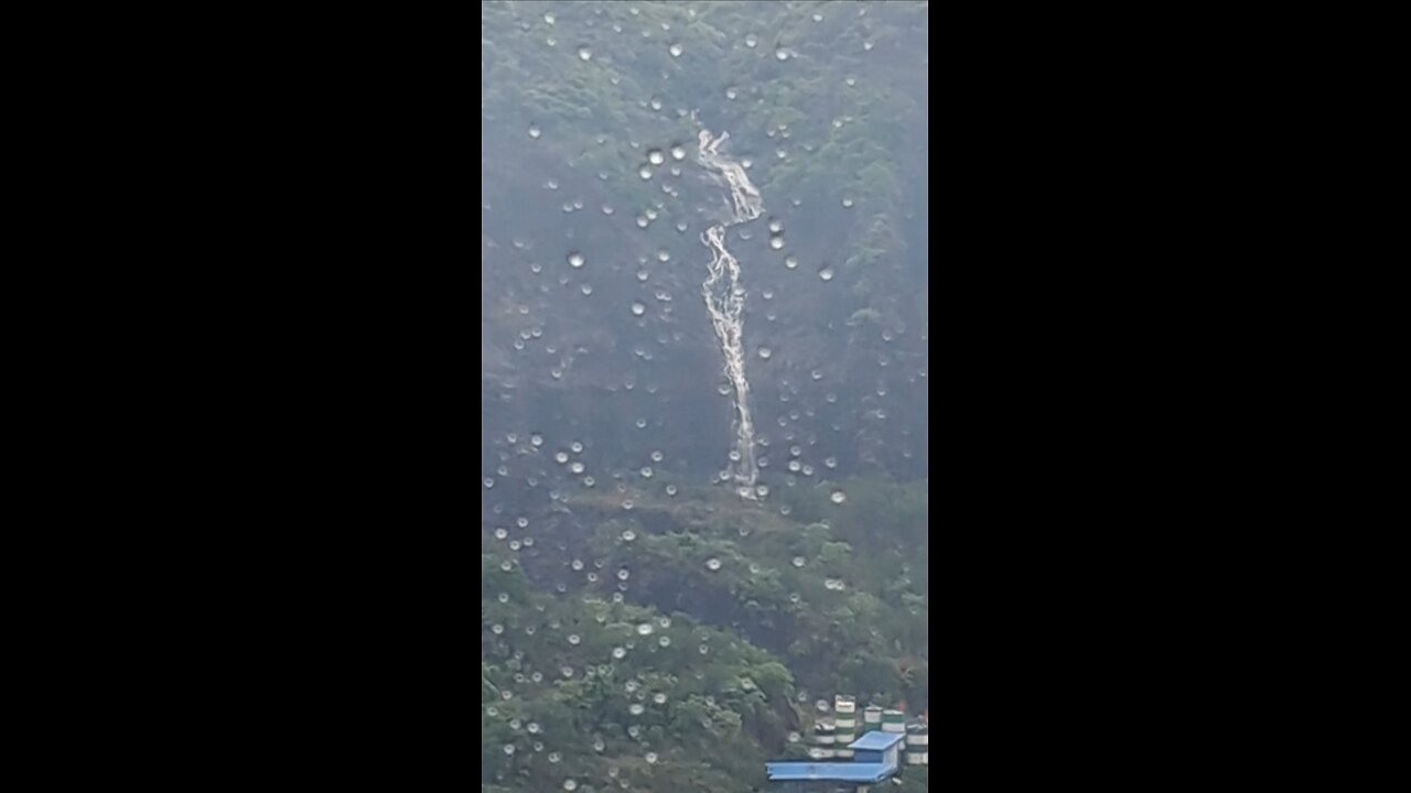 Stunning Waterfall View with Mountain
