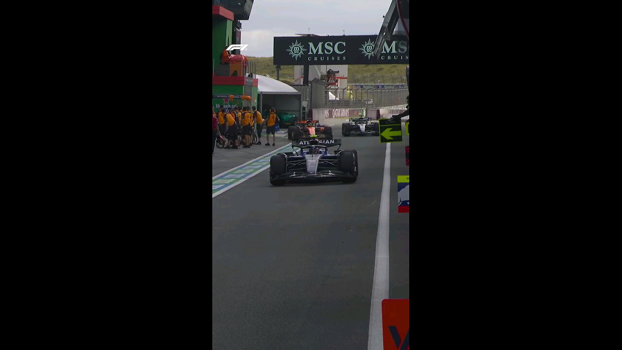 A close one between George and Oscar in the pits
