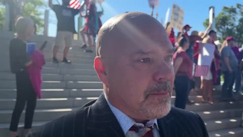 Dr. Kirk Moore is greeted by supporters outside of court