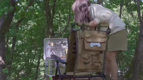Pretty girl camping with a transparent tent, Grilled chicken thighs . Enjoy fresh air