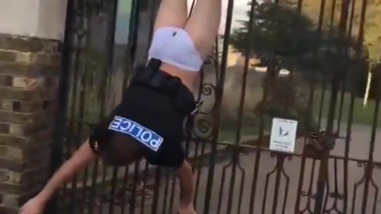 Cop gets stuck on the fence 😂😂😂