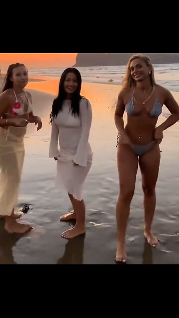 Damn she can run fast! Girls in bikinis on beach race.