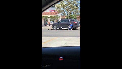 Man's gotta eat. Man was spotted catching pigeons in a parking lot