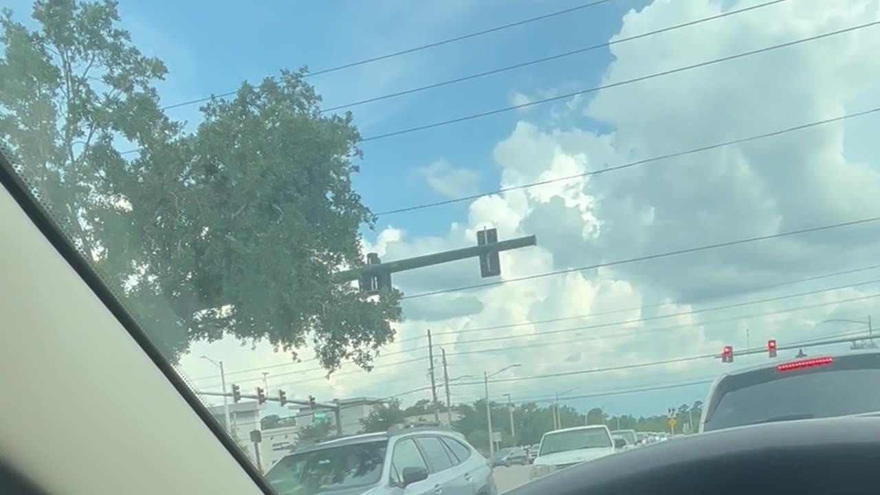 Driver Pulls Into Oncoming Lane at Intersection