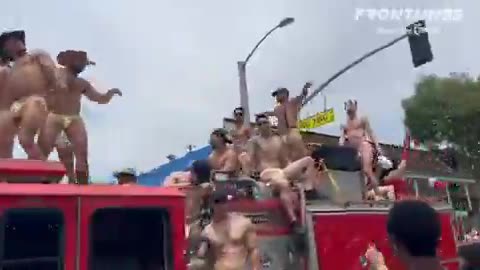 Men wearing underwear and f*tish gear dance provocatively in front of children