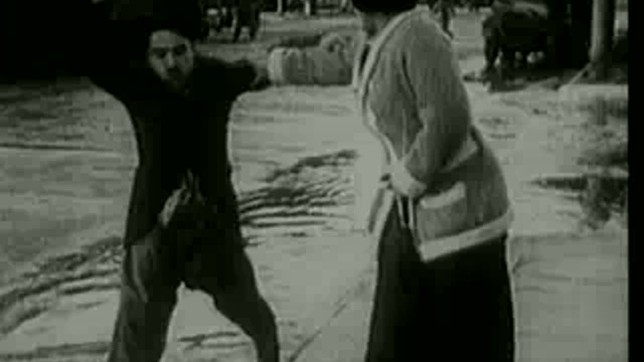 Charlie Chaplin's Between Showers (1914)