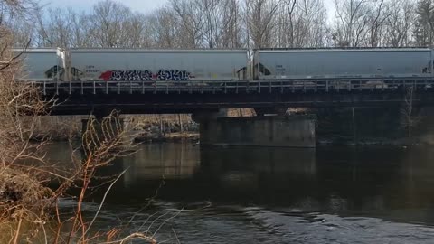 P&W GP38-2 races a cut of hoppers back to the valley.