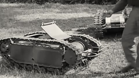 US soldiers messing around with Goliath tracked mines captured in Italy in 1944