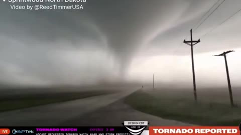 Stormchasers Get Crazy Close to a Large Tornado in North Dakota