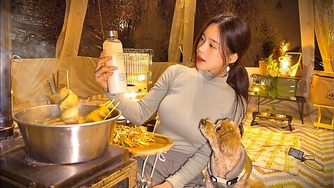 Camping next to a valley A glass of homemade makgeolli