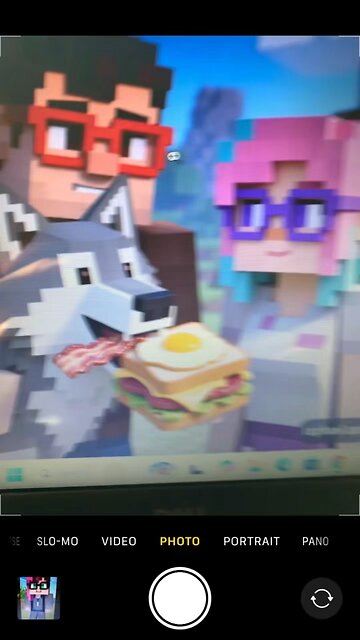 A photo of me Mormon and our pet wolf eating a bacon egg cheese sandwich in Minecraft