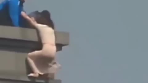Saving a woman by grabbing on her (real) hair
