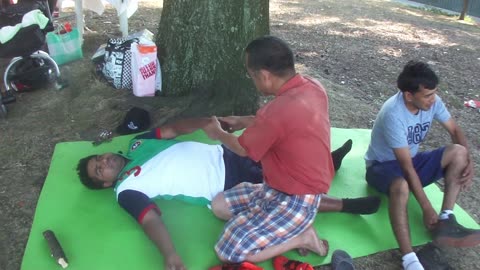 Luodong Briefly Massages Man By The Tree