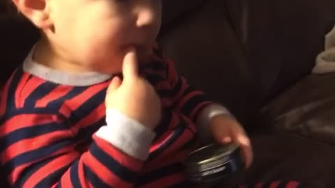 Baby Gets Curious While Playing With a Tin Can